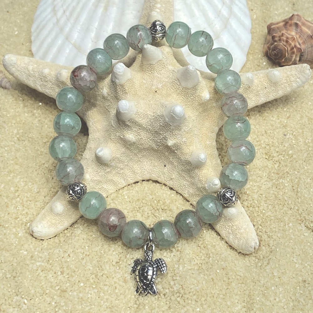 Beaded bracelet - light green and silver tone with turtle charm